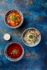 Different soups and sauses from different countries cousine with vegetables or meat
