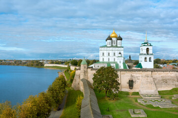Holy Trinity Cathedral in the city of Pskov. Beautiful view from above of the stone walls of the fortress wall and the cathedral.