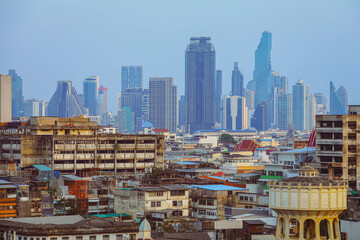 Selective focus on houses, city view of old Bangkok with modern buildings