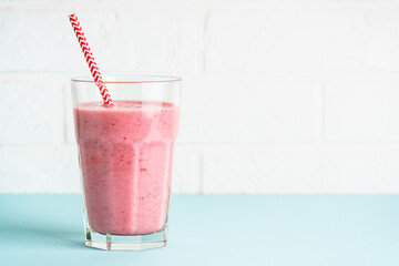 Strawberry smoothie or milkshake on white.