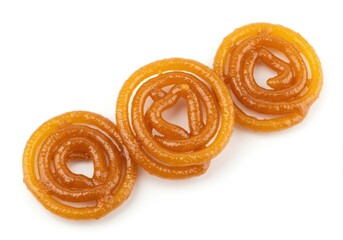 Fototapeta premium Three jalebi sweets arranged on a white background for indian dessert concept