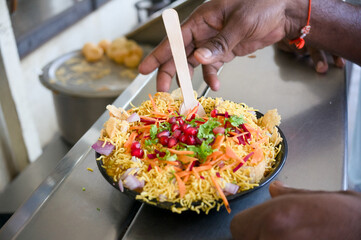 Colorful bhel puri served in a street food setting