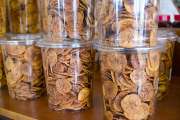 Clear containers of fresh banana chips for sale