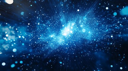 Obraz premium Particle explosion with ethereal glowing blue lights spreading across space picture