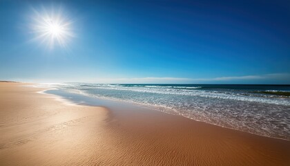 Fototapeta premium Deserted Beach Under Intense Sunlight with Reflecting Sand and Bright Blue Sky and Gentle Waves