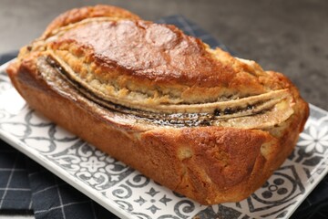 Delicious banana bread on grey table, closeup