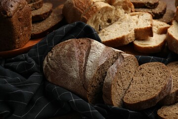 Different types of fresh bread on table, closeup