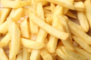 Tasty french fries as background, top view