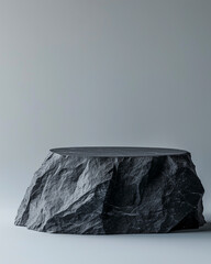 Two stacked black stone slabs with rough edges on a gray background. 