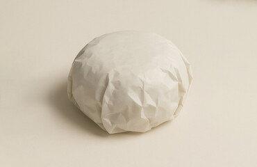 Blank white paper burger or sandwich wrap packaging mockup for  fast food restaurant branding or logo presentation isolated on a white beige background