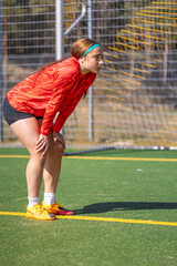 Girl soccer player. Girl in sports uniform on the soccer field. Football concept.