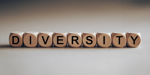 Wooden cubes spelling "Diversity", showcasing inclusivity and acceptance concept
