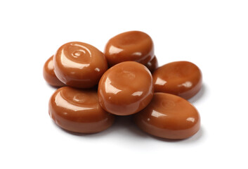 Tasty sweet caramel candies isolated on white