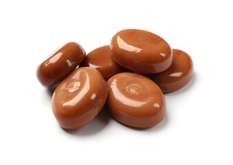 Tasty sweet caramel candies isolated on white