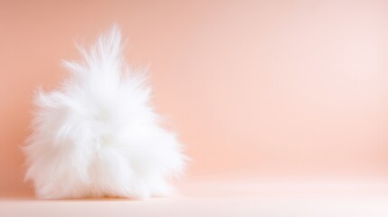 Fluffy white fur pile against a soft peach background