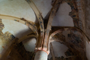 Inside view of ancient chapel of San Baudelio de Berlanga with preserved murals depicting ornamental patterns, outlandish animals and hunting scenes, Caltojar, Spain