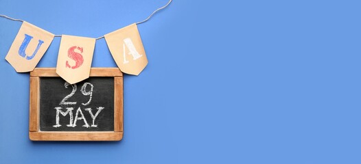 Garland with word USA and chalkboard on blue background with space for text. Banner for Memorial Day