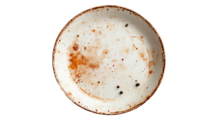 Used plate with food residue and crumbs Shows an almost empty plate after a meal