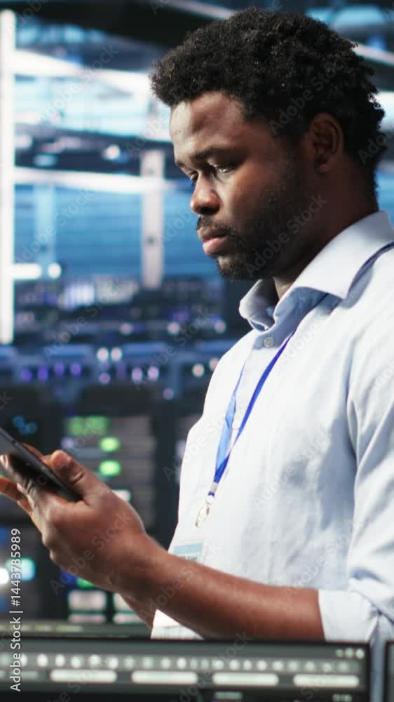 Poster vertical video data center technician uses node tree programming interface to identify equipment per