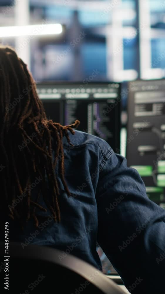 Poster vertical video irritated data center engineer punching desk, irked by glitches while using algorithm