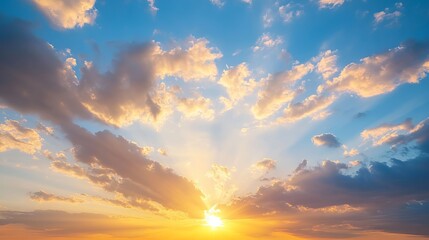 Fototapeta premium Stunning sunset sky dramatic cloudscape golden hour peaceful atmosphere beautiful orange yellow blue