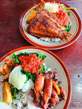 Nasi tempong is a traditional dish from Banyuwangi, East Java, Indonesia. The name "tempong" comes from the Osing language (a local dialect in Banyuwangi) and means "slap"