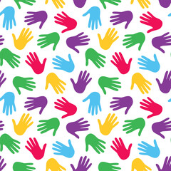 Seamless pattern with bright multicolored palms of hands. Vector background design with various handprints for wrapping paper, textile and fabrics