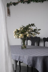 dying roses in a vase