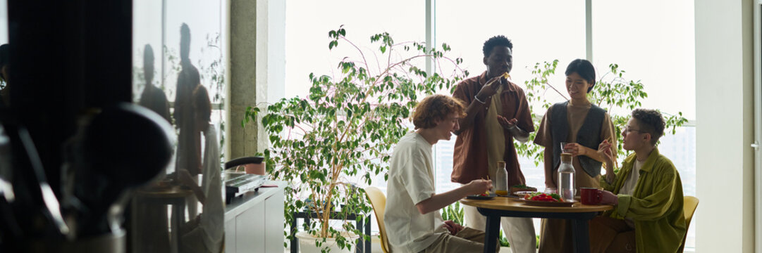 Diverse Friends Having Lunch in Spacious Kitchen Header