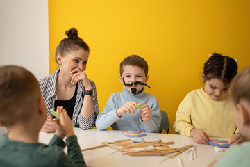 Creative children's art lesson with clay and costumes