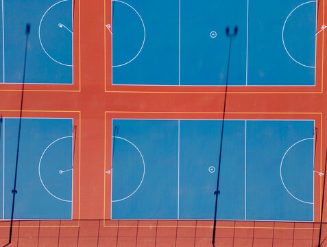 Aerial view of vibrant, colorful netball courts in Canberra