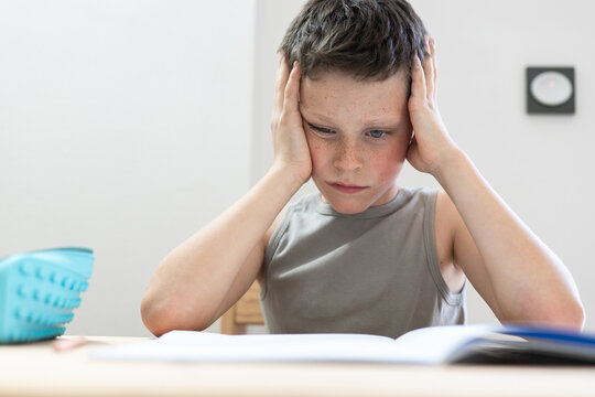 Young student focused on solving homework challenges