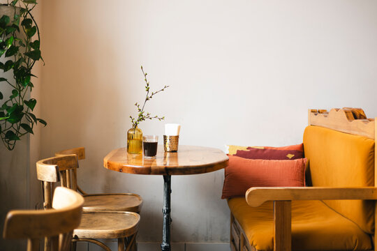 Cozy corner with rustic table and warm decor in a cafe