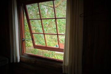 Fototapeta premium Historic window opened up to greenery