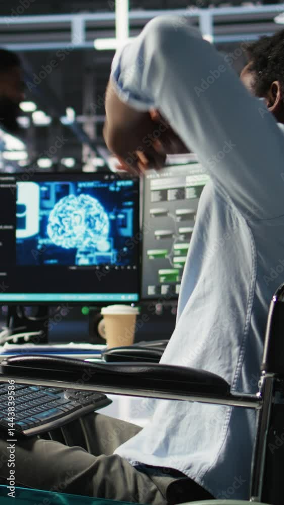 Poster vertical video engineer using wheelchair in data center using ai node tree software to minimize syst
