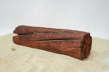 wood on beach sand isolated