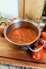 Vertical shot of homemade filetto sauce. Concept of fresh tomato sauce.