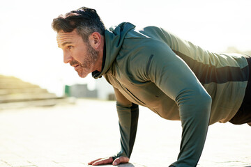 Fitness, push up and man in city in morning for bodybuilding training, exercise and workout....