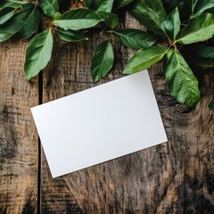 Blank White Card Mockup with Green Leaves on Rustic Wooden Background