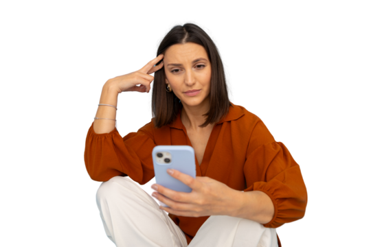 Young woman cross-legged, texting with pensive look against transparent backdrop - Powered by Adobe
