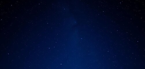 Fototapeta premium Dark blue night sky wallpaper, realistic starry backdrop with glowing blue stars , starry night, deep space