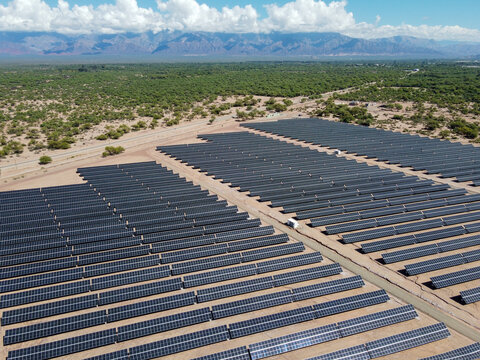 The dawn light illuminates the extensive solar panel fields in Tinogasta, Catamarca, Argentina. A symbol of Argentina's commitment to clean energy and sustainable development.