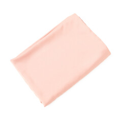 Pink silky bed linens on white background, top view