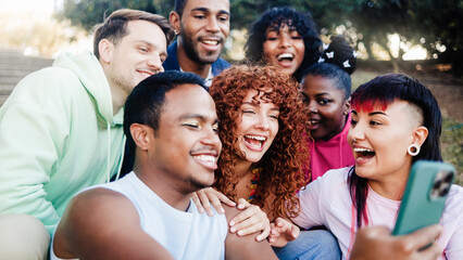 Diverse friends have fun on park city in summer vacation. Group of people smile at camera for selfie on travel vacation