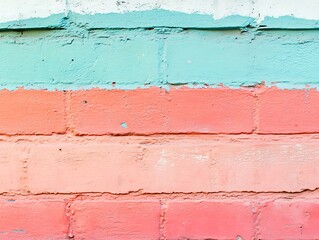 Obraz premium Urban brick wall with vibrant layers of paint in teal and shades of pink