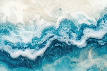 Obraz premium Aerial view of vibrant ocean waves crashing against the shore. showcasing intricate patterns of blue and white foam. with a serene beach landscape in the background