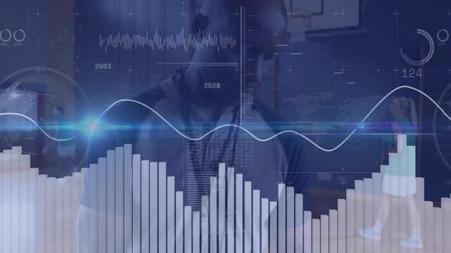 Coach analyzing technology data on basketball court with animated charts and progress indicators - Powered by Adobe