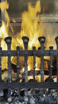 A gaucho traditional barbecue grill filled with charcoal on fire ready to be used to cook some nice meat 