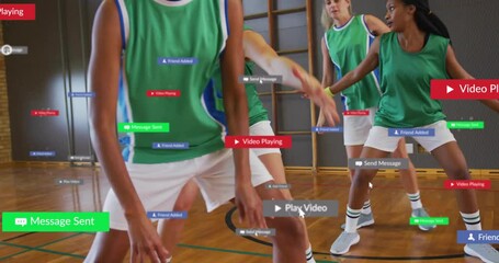 Women dribbling basketball on court, showing floating digital notifications with technology theme - Powered by Adobe