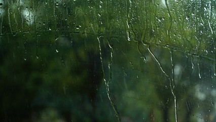 Raindrops on the windshield of the car